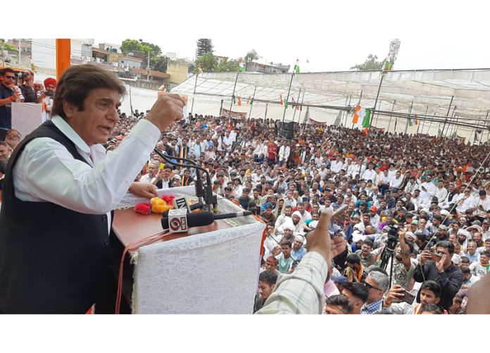 Senior AICC leader and Cong star campaigner Raj Babbar addressing a large election rally in Udhampur. -Excelsior/K Kumar