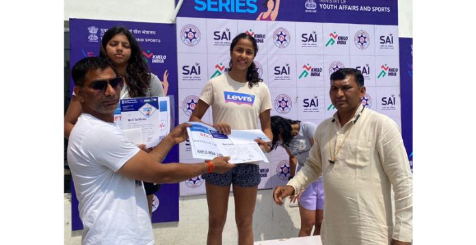 Vanshika receiving cash prize for her outstanding performance in Swimming Championship.