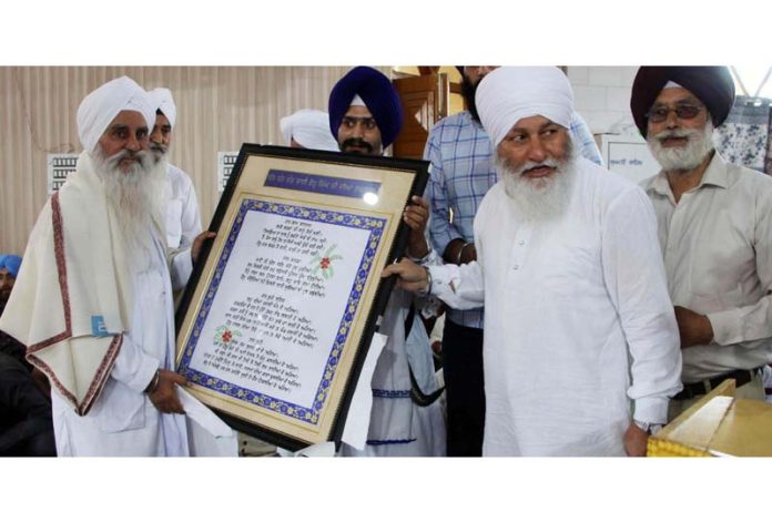 Mahant Manjit Singh, head priest, Dera Nangali Sahib is honored at a function in Jammu.