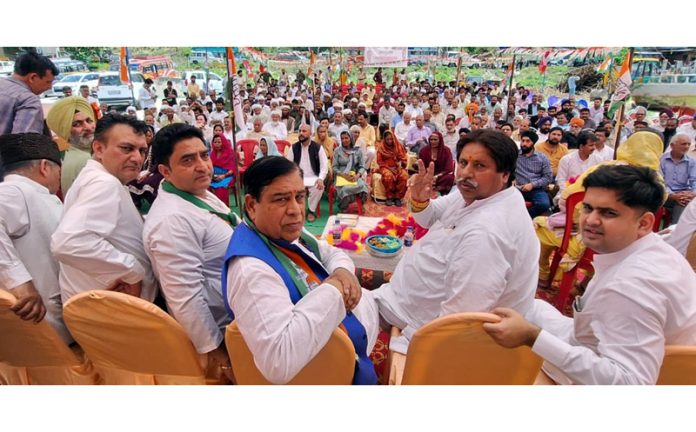 Senior Cong leaders Raman Bhalla, Ravinder Sharma and others during election rally in Reasi on Friday.