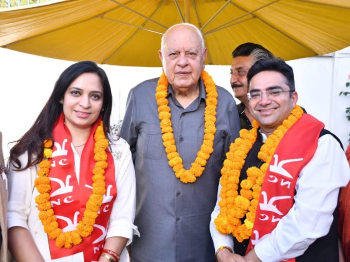 Vikram Puri posing with NC president Dr Farooq Abdullah after joining the party.