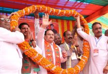 BJP National President JP Nadda being garlanded during a public meeting for Lok Sabha elections, in Lormi, Chhattisgarh on Monday. (UNI)