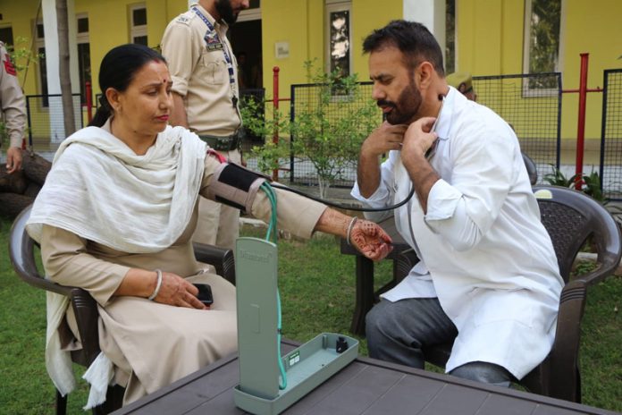 A GRP official being examined by a doctor on Wednesday.