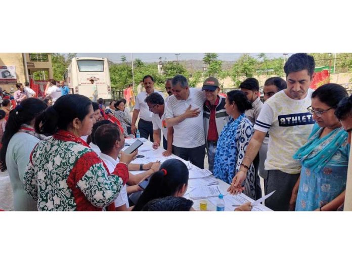 Doctors examining patients at the multi speciality health camp on Sunday.