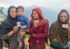 Three deaf and dumb sisters of village Dhadkahi show voters card before going to polling station in Doda on Friday.