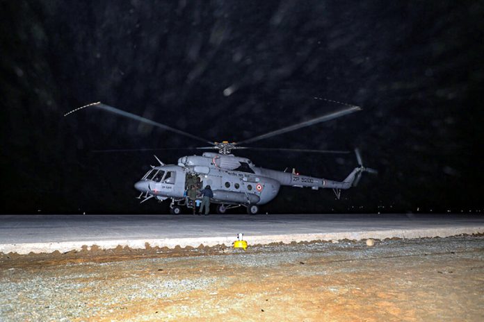 An IAF helicopter lands on Wanpoh-Sangam stretch of the Jammu-Srinagar National Highway on Tuesday.