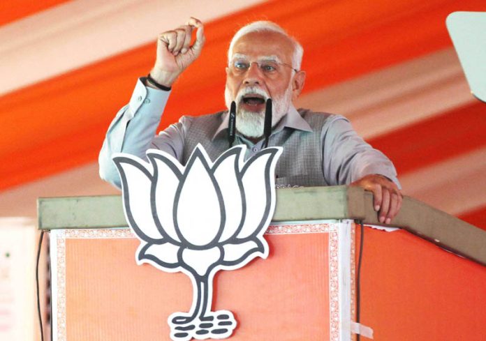 Prime Minister Narendra Modi addressing a public meeting ahead of Lok Sabha elections in Rishikesh on Thursday. (UNI)