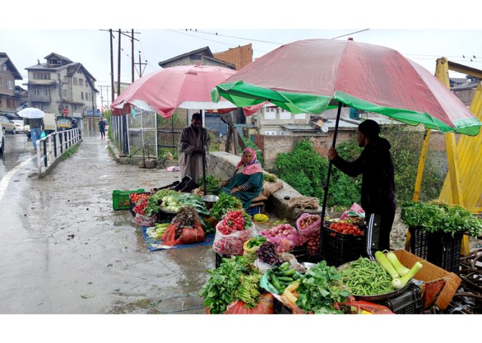 Incessant rains continue in Srinagar on Sunday. -Excelsior/Shakeel