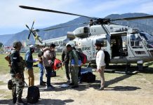 A polling party being airlifted to a hilly area in Kishtwar district on Wednesday.