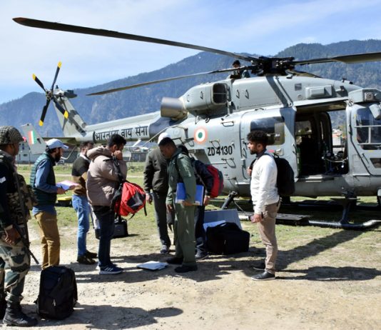 A polling party being airlifted to a hilly area in Kishtwar district on Wednesday.