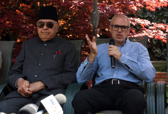 National Conference president Dr Farooq Abdullah and Omar Abdullah addressing a press conference in Srinagar. — Excelsior/Shakeel