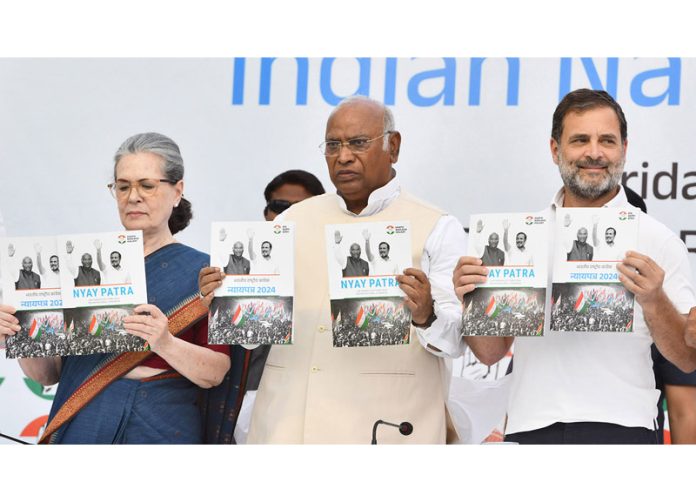 Congress president Mallikarjun Kharge with senior party leaders Sonia Gandhi and Rahul Gandhi releases the party's manifesto in New Delhi on Friday.(UNI)