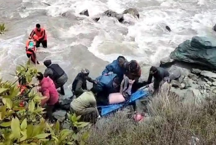 Rescue operation in progress at Gagangeer on Srinagar-Leh highway. -Excelsior/Firdous