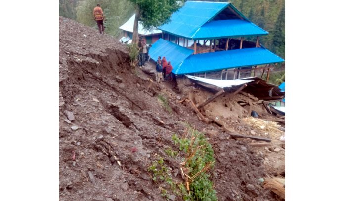 A four-storey house collapsed due to land slide in Village shadole of Reasi District. Another pic on Page 4.