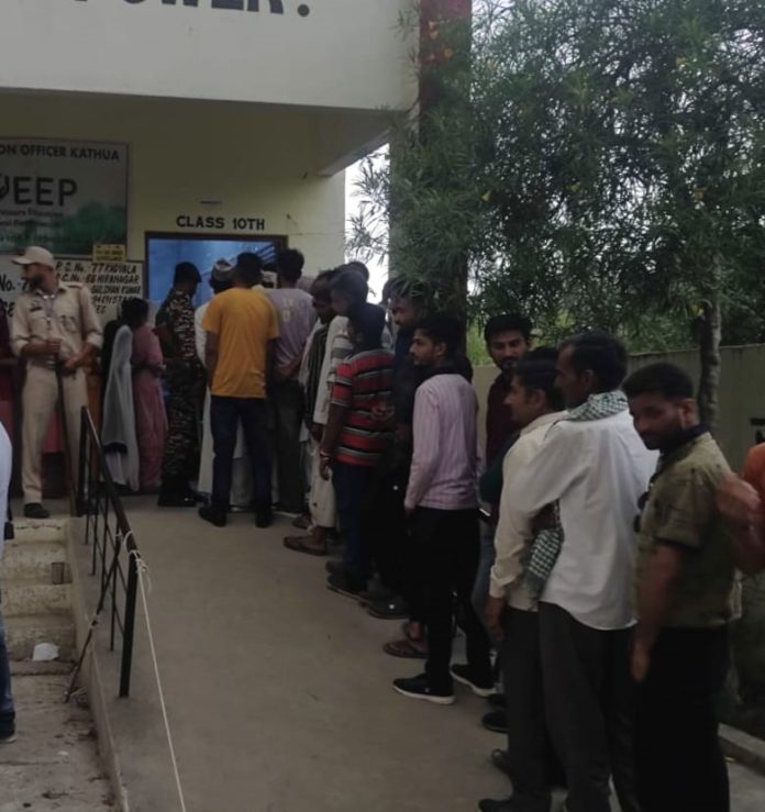 Voters waiting in a queue at Model Polling Station at border village Kadyala on Friday.