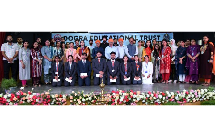 Meritorious students of Dogra Group of Colleges posing along with dignitaries.