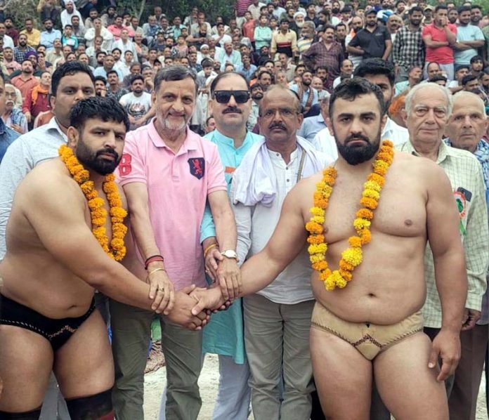 Wrestlers introduced before the main bout during 58th Kambal Danga International Dangal event at Reasi on Sunday.