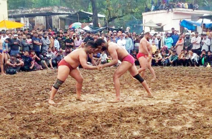 Wrestlers in action during 96th Jhajjar  Kotli Dangal on Tuesday.