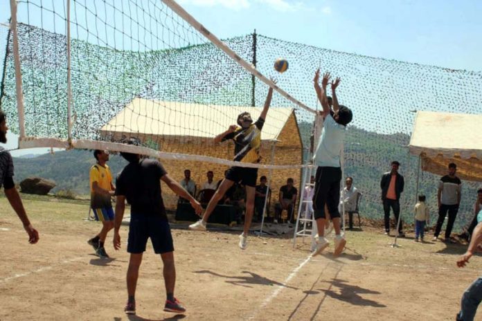 Players in action during a Volleyball match at Rajouri.