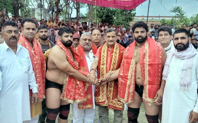 Dignitaries introducing wrestlers before a bout in Reasi on Monday.