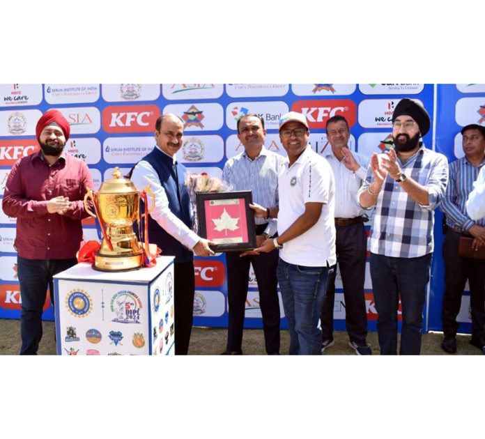 Div Com Jammu Ramesh Kumar along with Ranjeet Kalra Member J&K Sports Council receiving a memento during inaugural event of 5th T20 Deaf IPL in Jammu on Tuesday.