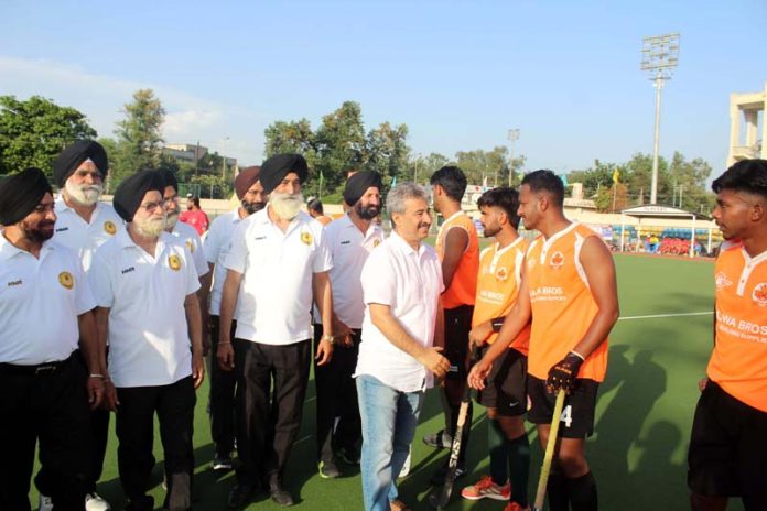 Chief guest interacting with players before start of 2nd semi-final match of Invitational Hockey Tournament at Jammu on Saturday.