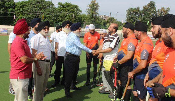 Chief Guest interacting with players before hockey match at Jammu on Wednesday.