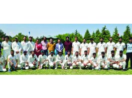 Cricket teams posing alongwith Kashmir University faculty during an inaugural cricket match in Srinagar.  