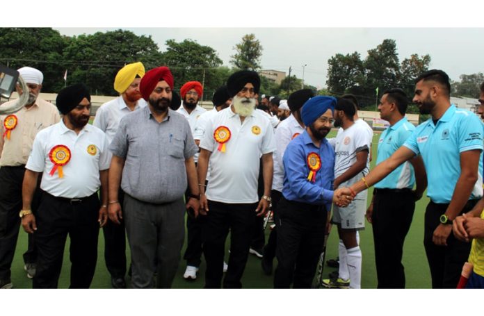 Transport Commissioner, Rajinder Singh Tara interacting with players during inaugural ceremony of hockey tournament at K K Hakku Stadium Jammu.