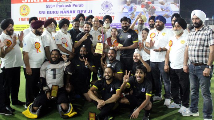 Dignitaries posing along with winning team Rail Coach Factory Kapurthala at K.K Hakku Stadium, Jammu.