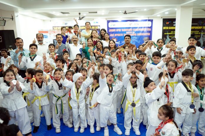 Junior Taekwondo players posing along with the chief guest during the Championship at Jammu.