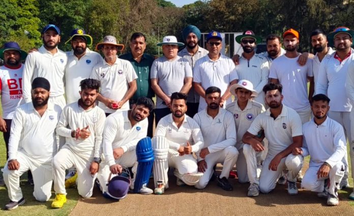 Players posing for group photograph during a league match at Jammu on Tuesday.