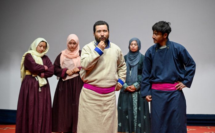 A scene from a play staged at Kargil to aware public about cyber frauds.