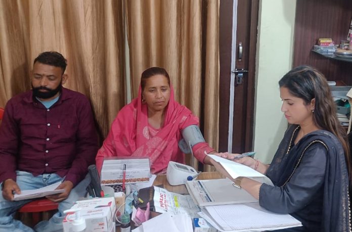 Dr Preeti Bhagat along with patients during a medical camp at Dablehar town of Jammu district.