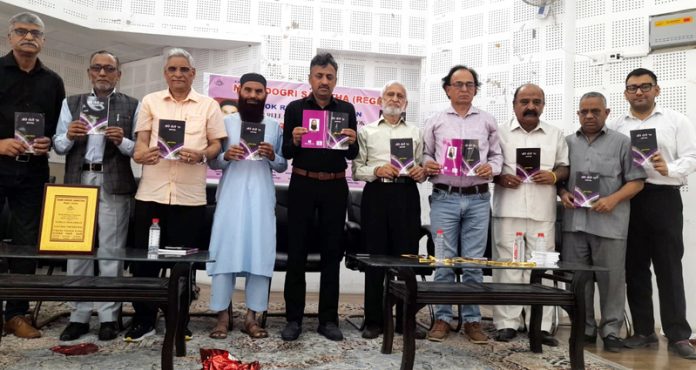 Dignitaries releasing a book during a function at Jammu on Wednesday.