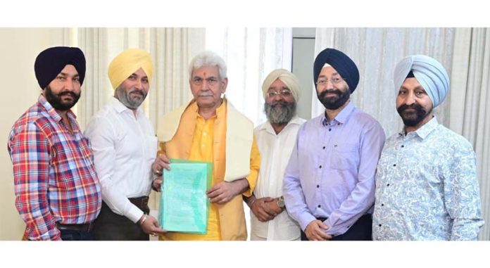 LG Manoj Sinha meeting delegation of Sikh Coordination Committee on Thursday.