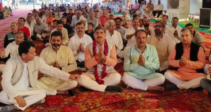 Jugal Kishore attending a religious programme at Daipur in Akhnoor constituency.