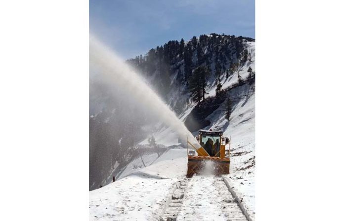 A BRO machine clearing snow at Chattergalla Pass on Bhaderwah-Bani road on Thursday. -Excelsior/Tilak Raj