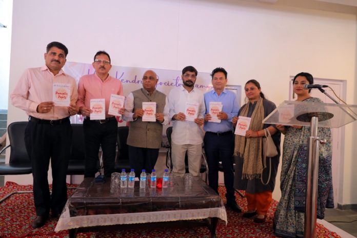 Dignitaries releasing a catalogue of modern art paintings during an exhibition at Jammu on Tuesday.