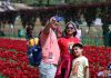 Tourists at Tulip Garden in Srinagar on Monday. — Excelsior/Shakeel