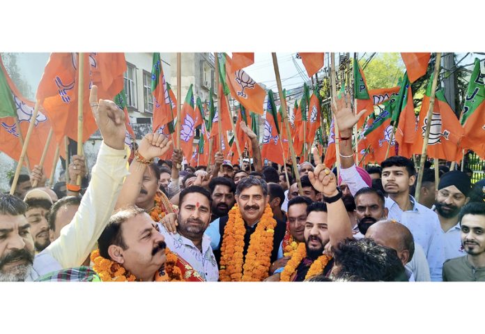 BJP candidate for Jammu -Reasi constituency, Jugal Kishore Sharma during a road show in holy town of Katra on Sunday.