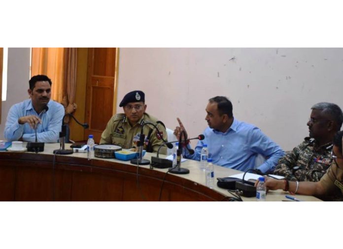 Div Com and ADGP chairing a meeting at Rajouri.