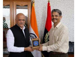 NIA DG Sadanand Vasant Date being greeted with a souvenir by DGP RR Swain in Jammu on Monday.