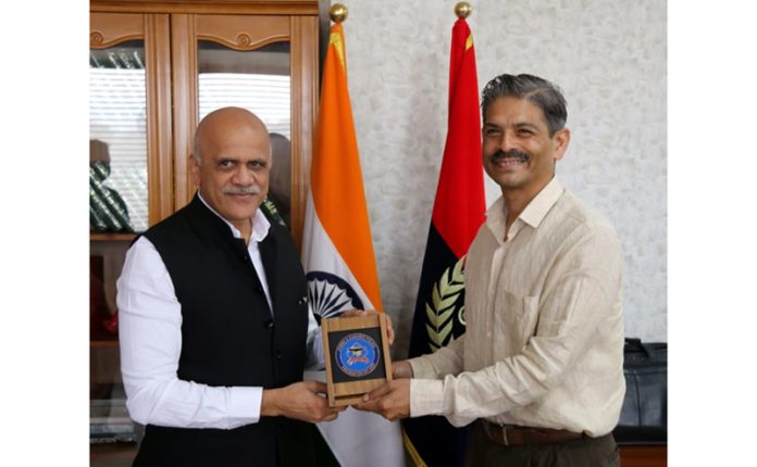 NIA DG Sadanand Vasant Date being greeted with a souvenir by DGP RR Swain in Jammu on Monday.