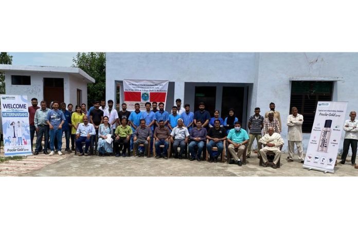 Faculty of SKUAST-J pose for a group photograph during a function on World Veterinary Day at R.S Pura.