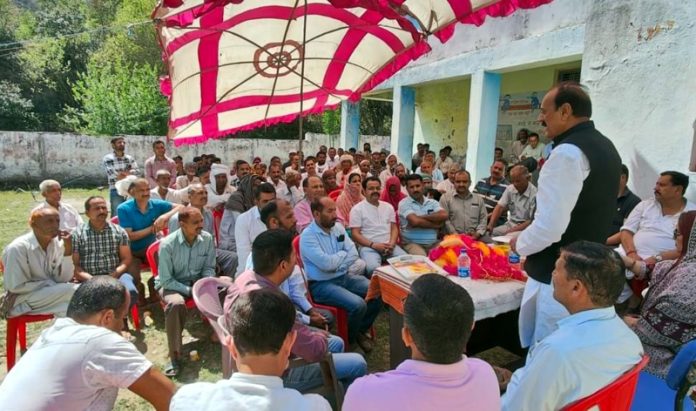 Former Minister and BJP vice president, Surjit Singh Slathia addressing party activists at village Sarna in Samba district on Saturday.
