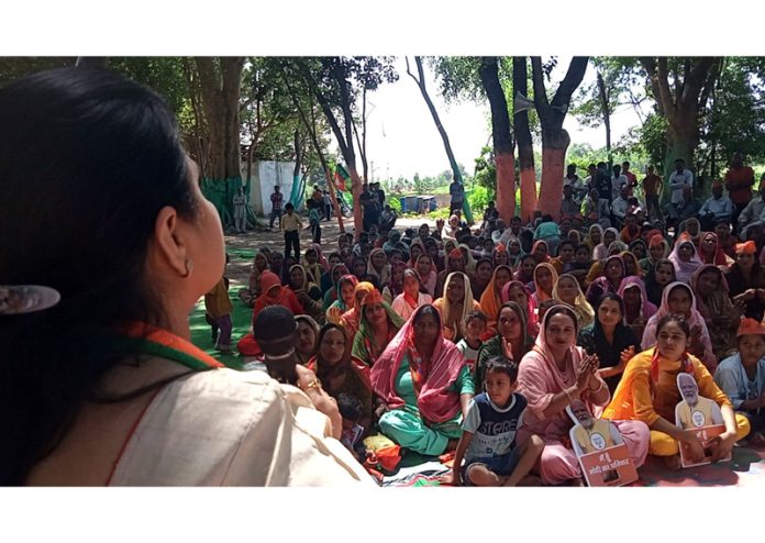 BJP National executive member, Priya Sethi addressing a campaign rally in Marheen area of Kathua.