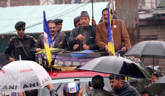 Advocate Saleem Parray Democratic Progressive Azad Party (DPAP) candidate for Anantnag-Rajouri Lok Sabha seat with party Chairman Ghulam Nabi Azad on his way to file nomination papers for the upcoming Lok Sabha elections on Friday.(UNI)