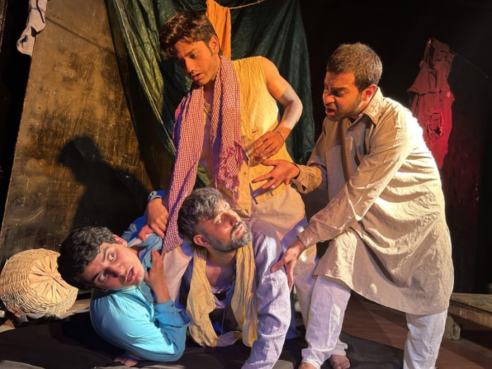 A scene from the play 'Kafan' staged at Jammu on Sunday.