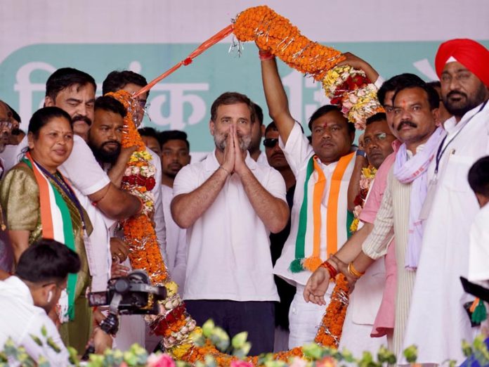 Congress leader Rahul Gandhi being garlanded by supporters at an election rally in support of party candidate for the 2024 Lok Sabha election in Bastar, Chhattisgarh on Saturday. (UNI)